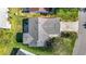 Birds eye view of a beautifully landscaped home with well manicured lawn and paved driveway at 840 Cortez Ave, The Villages, FL 32159
