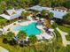 Aerial view of community pool, seating and eating areas at 840 Cortez Ave, The Villages, FL 32159