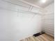 Organized walk-in closet features wood floors and plenty of shelving for maximum storage at 840 Cortez Ave, The Villages, FL 32159