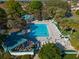 Aerial view of a stunning community pool, perfect for relaxing and soaking up the sun at 840 Cortez Ave, The Villages, FL 32159