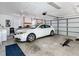 Spacious garage featuring ample storage, a vehicle, and an automatic door opener for convenience at 840 Cortez Ave, The Villages, FL 32159