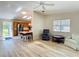 Open-concept living room and kitchen featuring modern appliances and a cozy seating area at 840 Cortez Ave, The Villages, FL 32159
