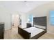 Comfortable main bedroom featuring wood-look flooring, closet, and a neutral color scheme for a restful retreat at 840 Cortez Ave, The Villages, FL 32159