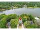 Aerial view of a tree-lined neighborhood with a lake in the background at 858 Lake Marion Dr, Altamonte Springs, FL 32701