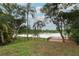 Spacious backyard with lush green grass and scenic lake views at 858 Lake Marion Dr, Altamonte Springs, FL 32701
