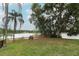 Large backyard featuring a wooden deck and stunning lake views at 858 Lake Marion Dr, Altamonte Springs, FL 32701