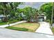Front exterior featuring a circular driveway with lush landscaping at 858 Lake Marion Dr, Altamonte Springs, FL 32701