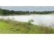 Picturesque view of the tranquil lake surrounded by lush greenery at 858 Lake Marion Dr, Altamonte Springs, FL 32701