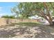 Spacious backyard with a large tree providing shade and a wooden fence surrounding the property at 1011 Terry Dr, Altamonte Springs, FL 32714