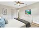 Furnished bedroom featuring a flat screen TV, dresser, and a gray throw blanket at 1011 Terry Dr, Altamonte Springs, FL 32714
