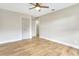 Empty bedroom featuring a ceiling fan, wood-look flooring, and a closet door at 1011 Terry Dr, Altamonte Springs, FL 32714