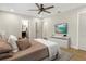 Comfortable bedroom featuring a ceiling fan, neutral walls, and doorway to the bathroom at 1011 Terry Dr, Altamonte Springs, FL 32714