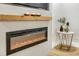Close up of fireplace with wooden mantel and modern design elements at 1011 Terry Dr, Altamonte Springs, FL 32714