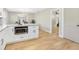 Open kitchen area featuring a large island and stainless steel microwave at 1011 Terry Dr, Altamonte Springs, FL 32714