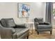 Living room featuring neutral tones, stylish chairs, and artwork at 1011 Terry Dr, Altamonte Springs, FL 32714