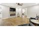 Spacious living room with a modern fireplace, wood mantel, and stylish furniture at 1011 Terry Dr, Altamonte Springs, FL 32714
