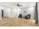 Bright living room with stylish seating, neutral walls, and wood flooring at 1011 Terry Dr, Altamonte Springs, FL 32714