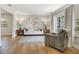 Cozy living room with neutral tones, bright window, and wood floors provides a relaxing atmosphere at 1011 Terry Dr, Altamonte Springs, FL 32714