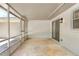 Screened-in patio with a concrete floor and sliding glass door leading to the backyard at 1011 Terry Dr, Altamonte Springs, FL 32714