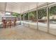 Enclosed screened patio with a view of the landscaped backyard and mature trees at 1011 Terry Dr, Altamonte Springs, FL 32714
