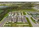 Aerial view of a well-planned community with tree lined streets, homes, and a playground at 10151 Salt Point Dr, Winter Garden, FL 34787