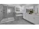 This bathroom has a tiled shower, soaking tub, and double vanity sink at 10151 Salt Point Dr, Winter Garden, FL 34787
