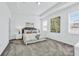 This bedroom has a trey ceiling, gray carpet, and soft, neutral wall color at 10151 Salt Point Dr, Winter Garden, FL 34787