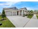 Charming single-Gathering home with a gray exterior, stone accents and a well manicured front yard at 10151 Salt Point Dr, Winter Garden, FL 34787