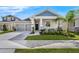 Charming single-Gathering home with a gray exterior, stone accents and a well manicured front yard at 10151 Salt Point Dr, Winter Garden, FL 34787