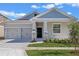 Charming single-Gathering home featuring a two-car garage and a beautifully landscaped front yard at 10151 Salt Point Dr, Winter Garden, FL 34787