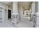 Charming front porch with stone accents on columns and a welcoming entrance at 10151 Salt Point Dr, Winter Garden, FL 34787