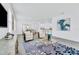 Open-concept living area with neutral decor, tile flooring and an inviting atmosphere for relaxation at 10151 Salt Point Dr, Winter Garden, FL 34787