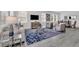 Open-concept living area with neutral decor, tile flooring and an inviting atmosphere for relaxation at 10151 Salt Point Dr, Winter Garden, FL 34787