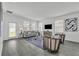 Open-concept living area with neutral decor, tile flooring and an inviting atmosphere for relaxation at 10151 Salt Point Dr, Winter Garden, FL 34787