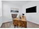 Cozy home office with a modern desk, stylish chair and natural light, ideal for remote work at 10151 Salt Point Dr, Winter Garden, FL 34787