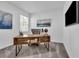 Cozy home office with a modern desk, stylish chair and natural light, ideal for remote work at 10151 Salt Point Dr, Winter Garden, FL 34787