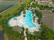A scenic aerial view of the resort-style community pool with ample seating and lush landscaping at 10151 Salt Point Dr, Winter Garden, FL 34787