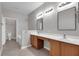 Bright bathroom with dual sinks and vanity area at 1028 Marietta Ln, Eustis, FL 32726