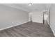 Spacious bedroom with natural lighting, hardwood floors, and neutral colors at 1028 Marietta Ln, Eustis, FL 32726