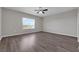 Expansive bedroom with natural light and hardwood floors at 1028 Marietta Ln, Eustis, FL 32726