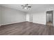 Spacious bedroom with modern ceiling fan and luxury vinyl plank flooring at 1028 Marietta Ln, Eustis, FL 32726
