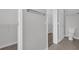 Walk-in closet with shelving and ample storage space provides organization at 1028 Marietta Ln, Eustis, FL 32726