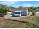 Charming single-story home with fenced yard, screened lanai, and well-maintained landscaping at 1028 Marietta Ln, Eustis, FL 32726