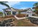 Charming single-story home featuring a well-manicured lawn and mature landscaping at 1028 Marietta Ln, Eustis, FL 32726