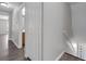 Hallway with stairs and view of bathroom showcases layout and access throughout the home at 1028 Marietta Ln, Eustis, FL 32726