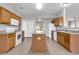 Spacious kitchen featuring an island, tile floors, and white appliances for a clean and modern look at 1028 Marietta Ln, Eustis, FL 32726