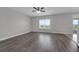 Bright, open-concept living room with stylish hard surface flooring at 1028 Marietta Ln, Eustis, FL 32726