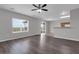 Open-concept living area with hard surface floors and a sliding glass door at 1028 Marietta Ln, Eustis, FL 32726