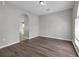 Open living room showcasing wood floors and a view into the kitchen at 1028 Marietta Ln, Eustis, FL 32726