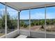 Screened-in patio with serene lake view, perfect for outdoor relaxation and enjoying nature at 1028 Marietta Ln, Eustis, FL 32726